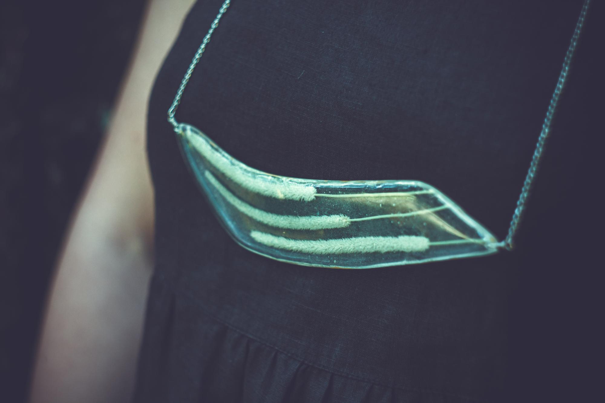 detailed embroidery on garment hung in studio