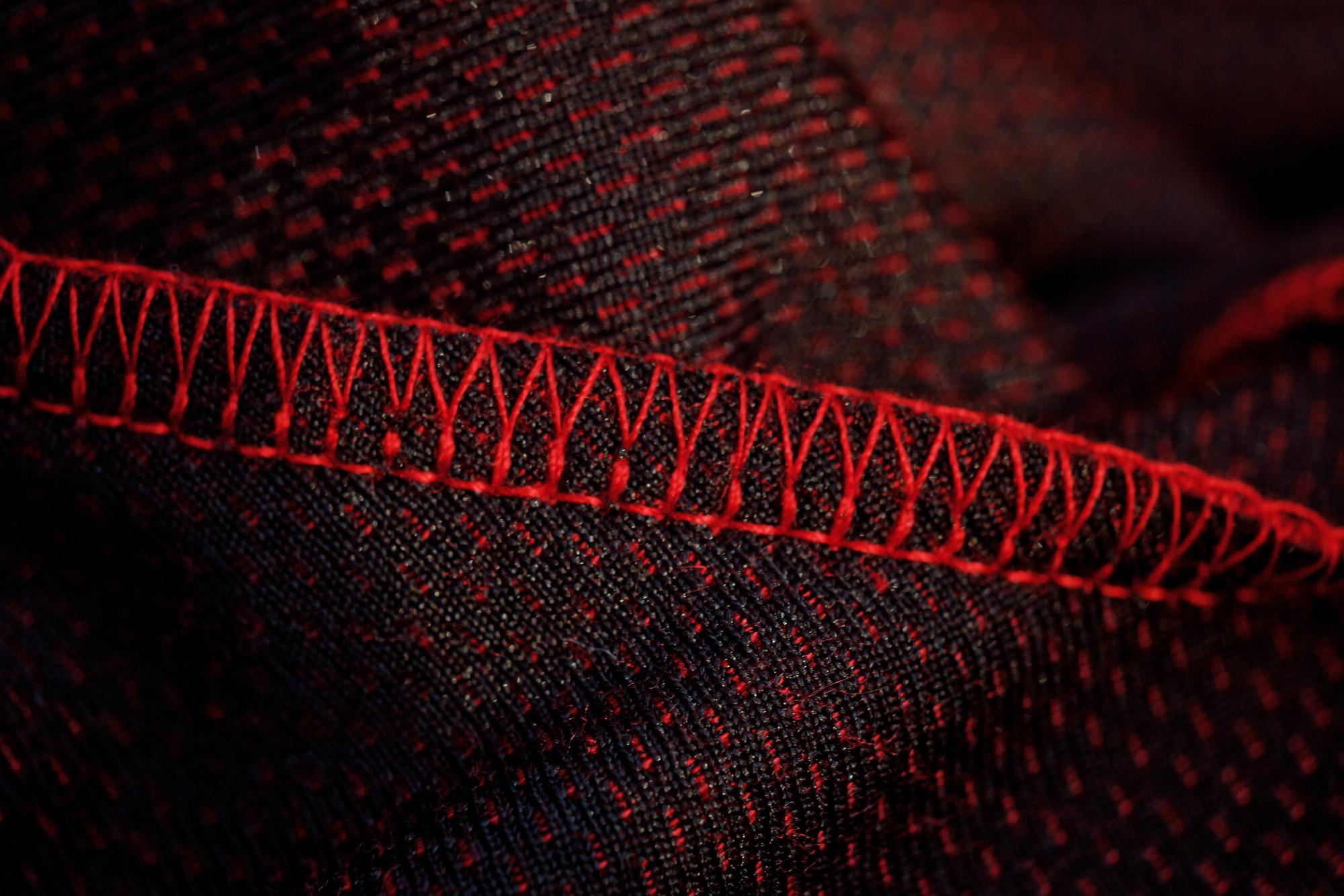 close-up of embroidered stitches on dark fabric